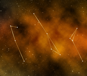 Constellations of stars against an orange-black background like clouds in outer space